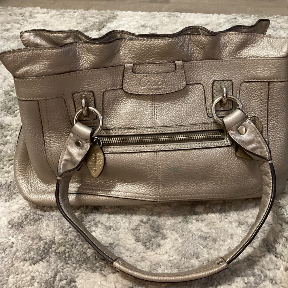 Silver pebble leather coach handbag